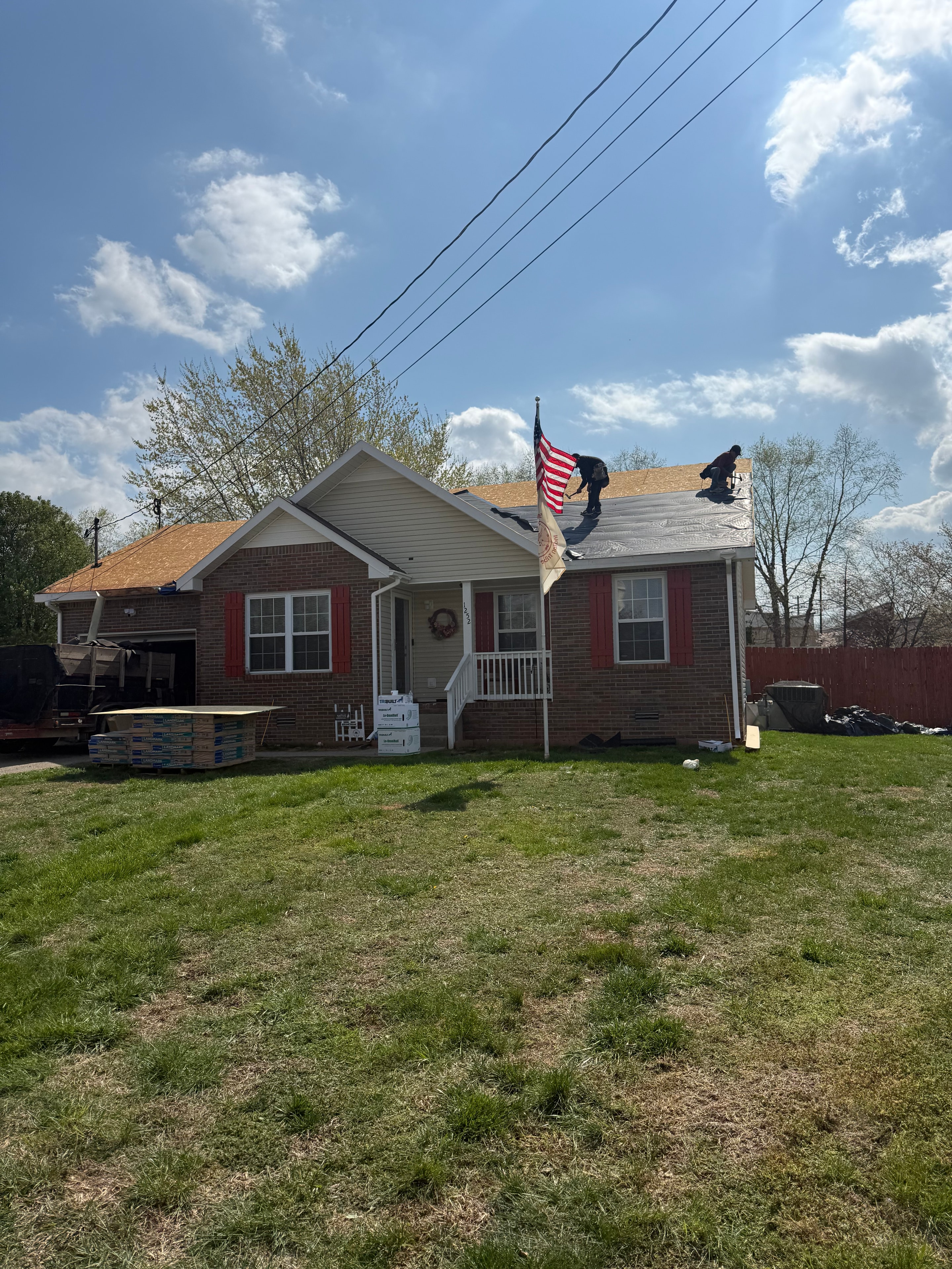 Areawide Restoration team working on a roof