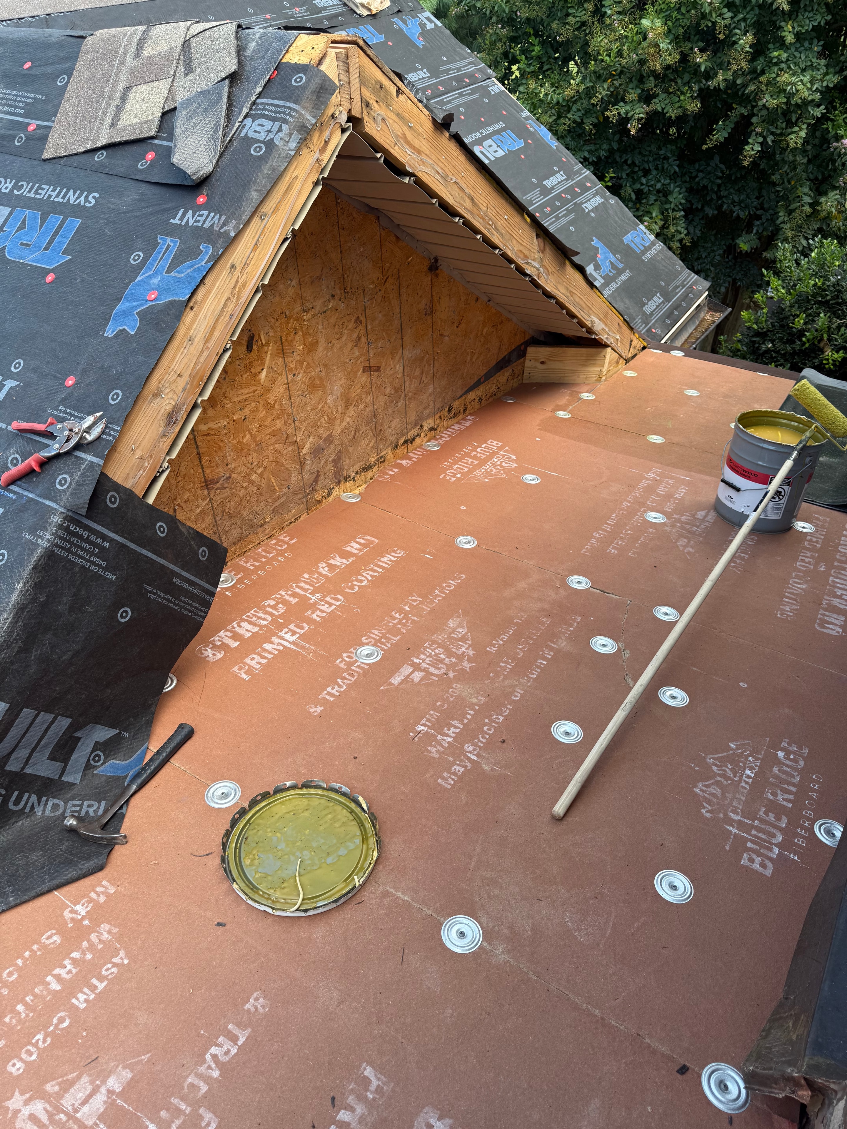 Close-up of Blue Ridge fiberboard and synthetic underlayment during skylight repair